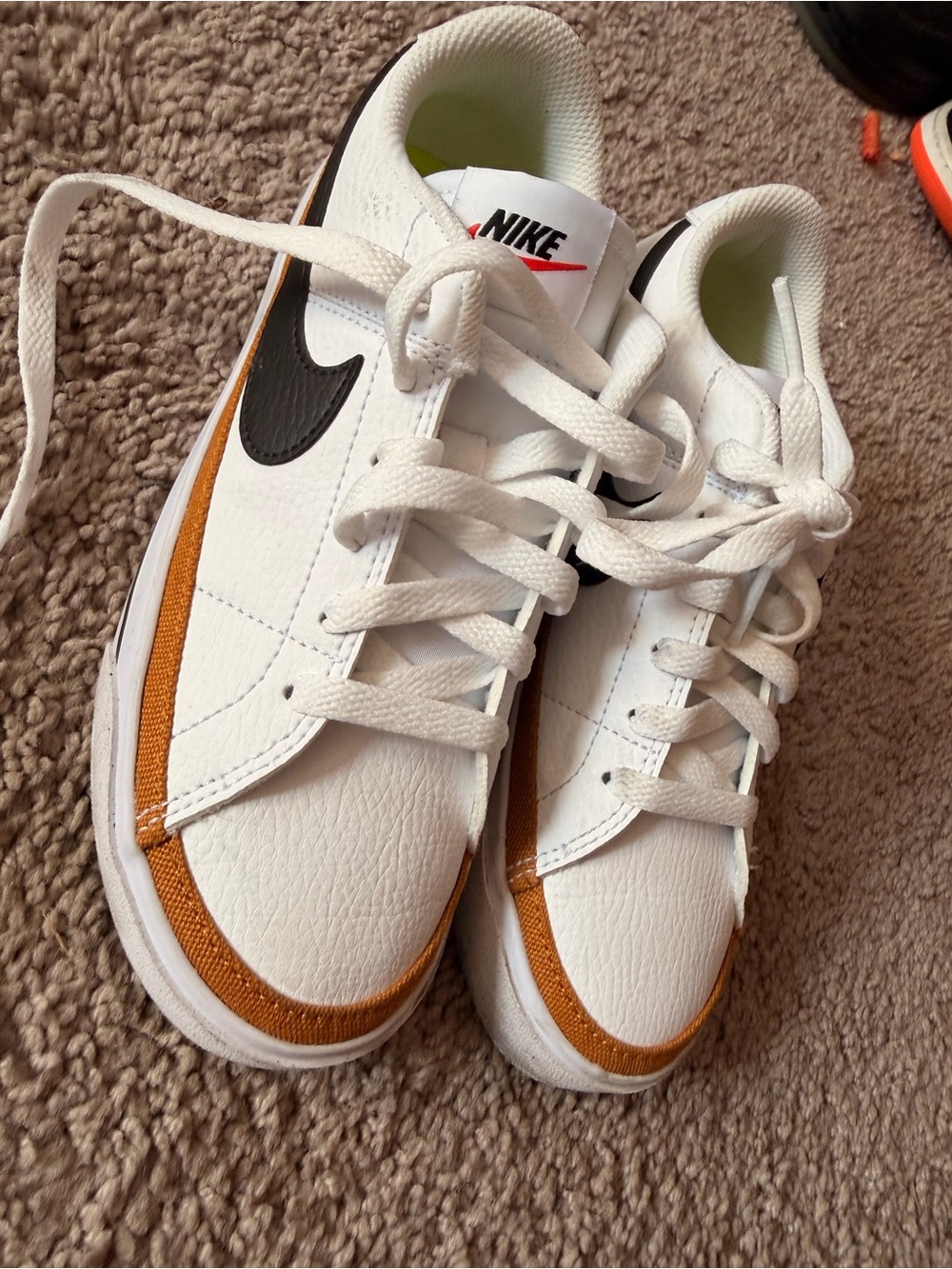 Nike White Sneakers with Brown Trim and Black Swoosh
